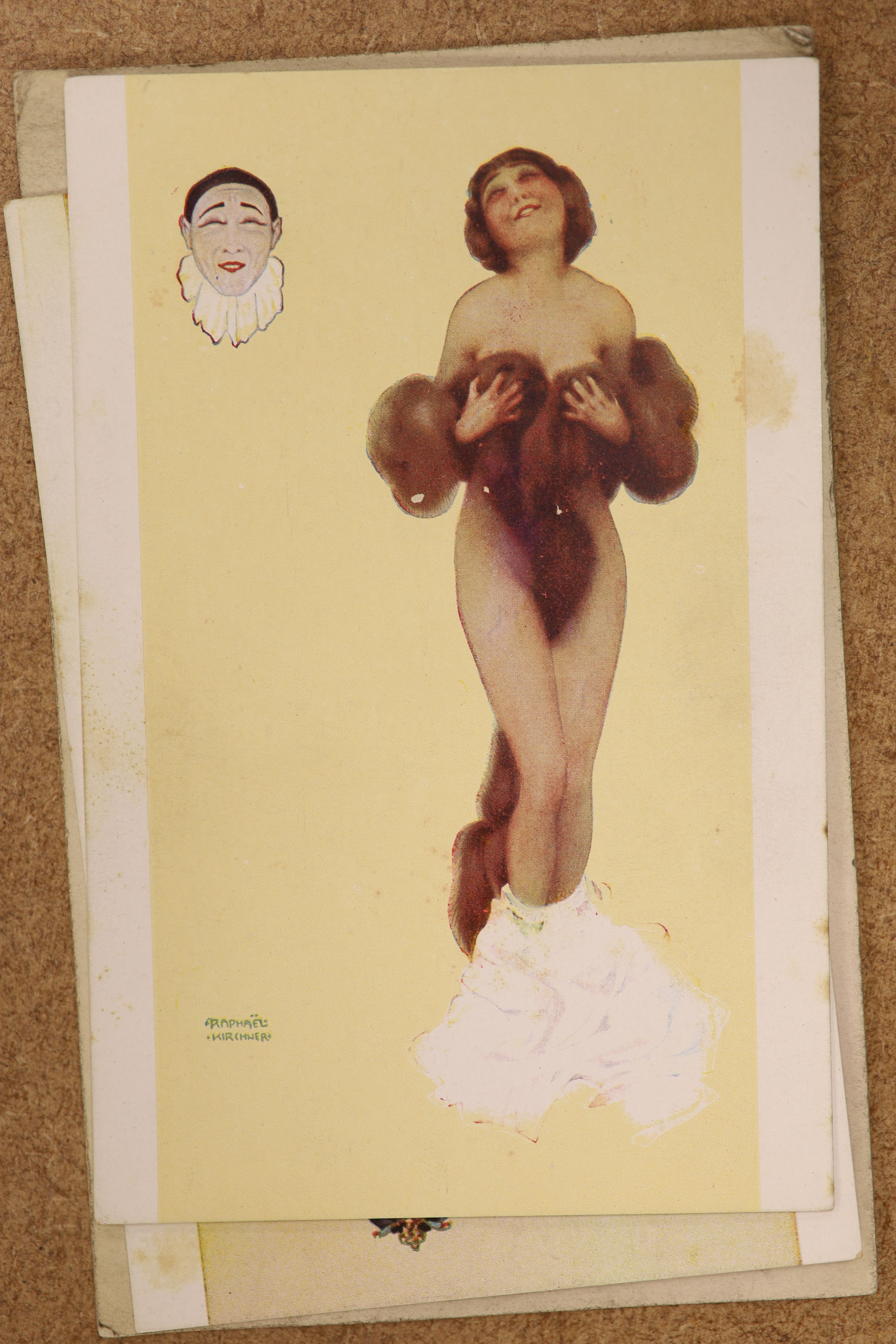 Three albums of photographs and a quantity of postcards inc. erotica.